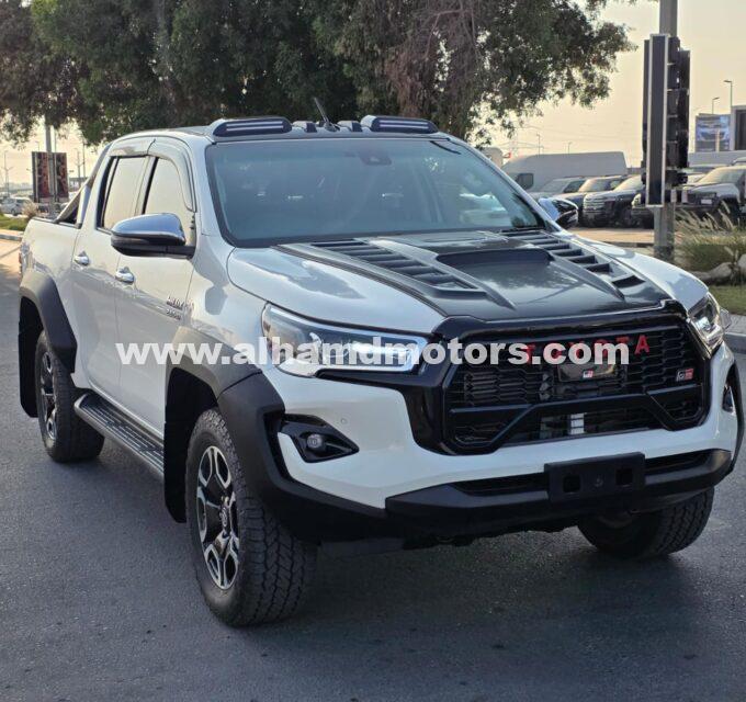 Buy the 2021 Toyota Hilux Pickup, facelifted to 2024 model, 4WD Diesel, Automatic Transmission, Right-Hand Drive, 16,700 km. White exterior, leather seats, alloy wheels, and premium features at Al-Hamd Motors.